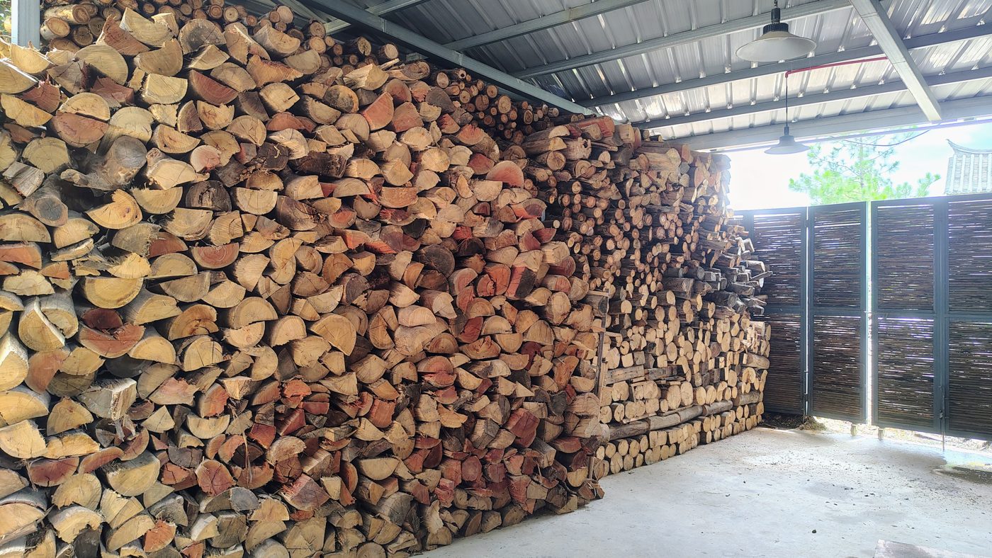 Firewood stacked for the kilns